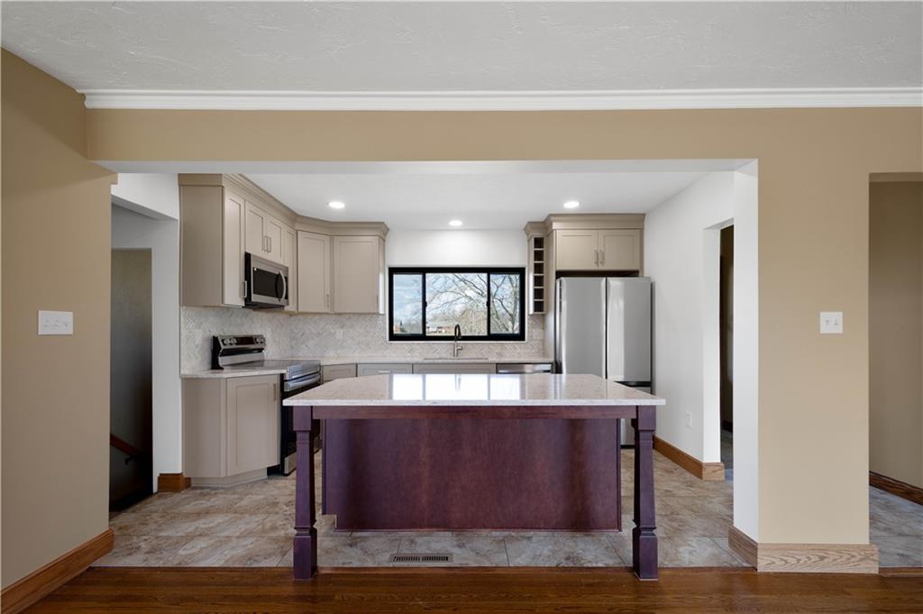 330 Center Grange Road Monaca, PA 15061 - Photo 5 of 26 a kitchen with stainless steel appliances granite countertop a refrigerator and a stove top oven