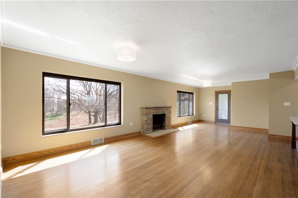 330 Center Grange Road Monaca, PA 15061 - Photo 6 of 26 a view of empty room with wooden floor and fireplace