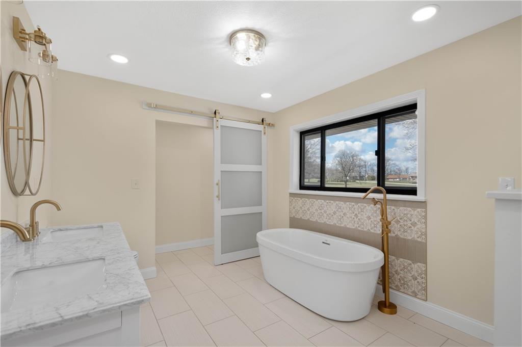 330 Center Grange Road Monaca, PA 15061 - Photo 9 of 26 a bathroom with a granite countertop sink a toilet and bathtub