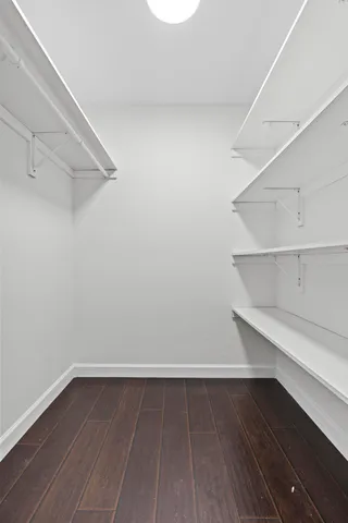 a view of an empty walk in closet