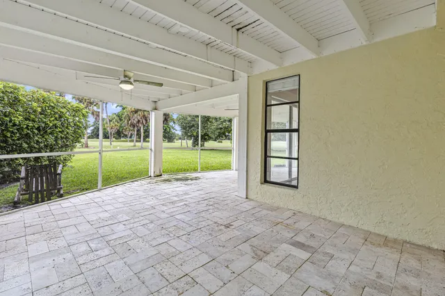 a view of an empty room with a balcony