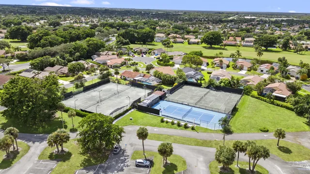 an aerial view of residential houses with outdoor space