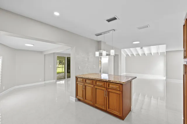 a bathroom with a sink a large mirror and a shower