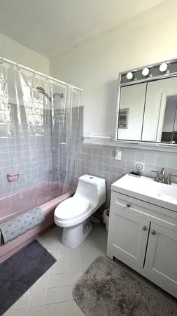 a bathroom with a sink a toilet and bathtub