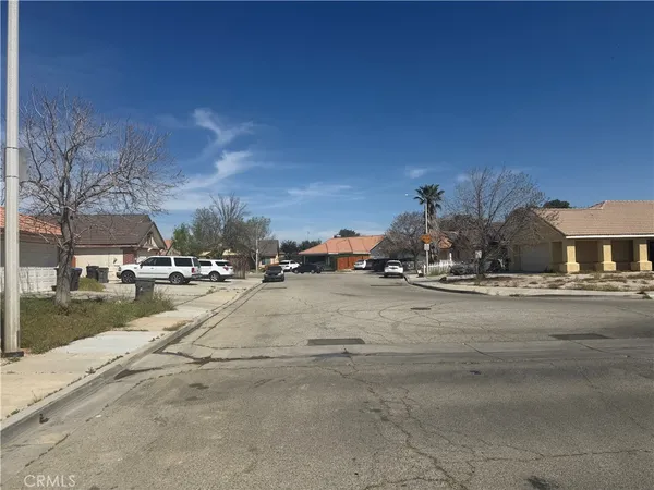 a view of street with parked cars