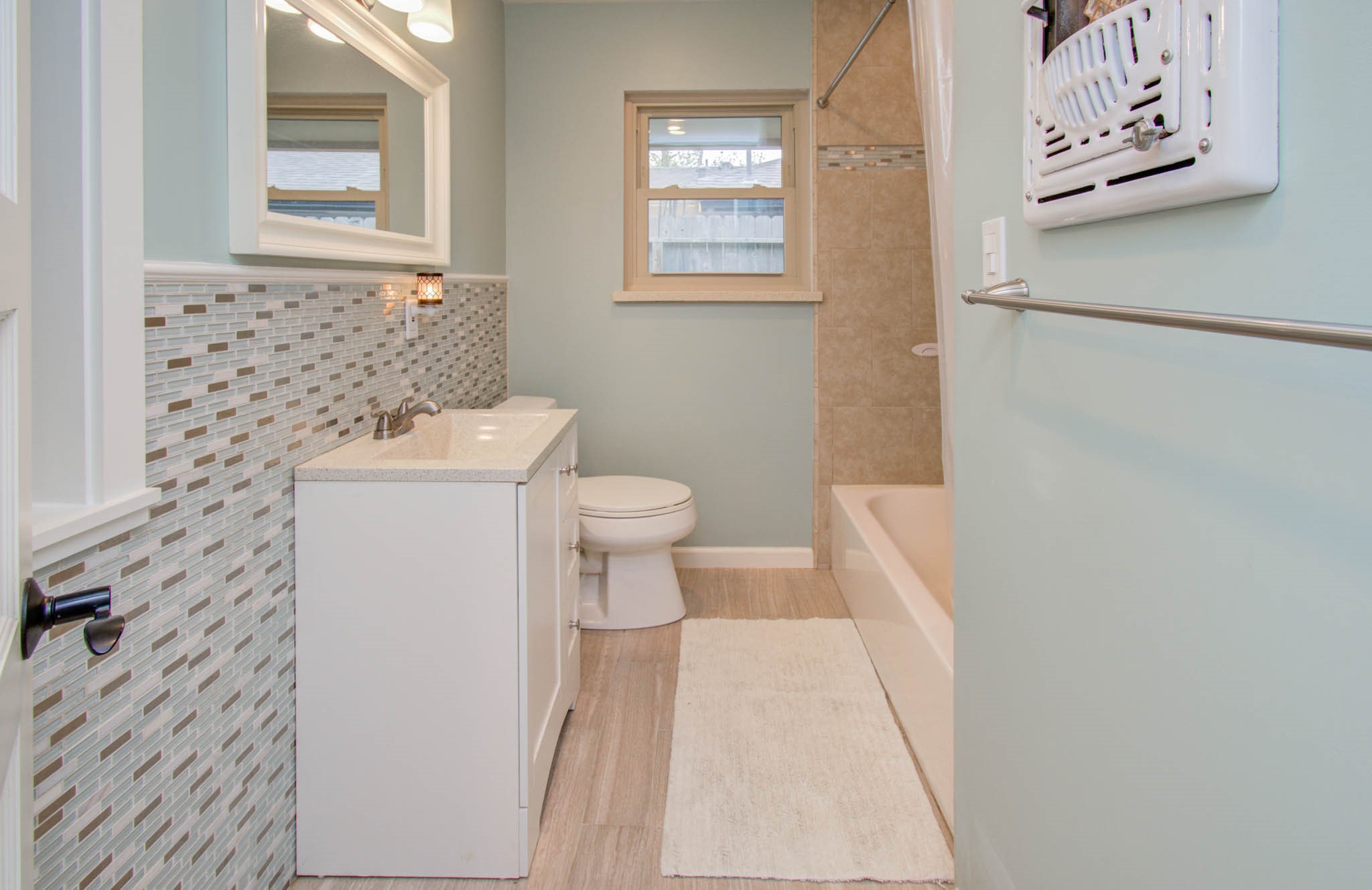 9002 Railton Street Houston, TX 77080 - Photo 22 of 32 a bathroom with a toilet and a shower curtain
