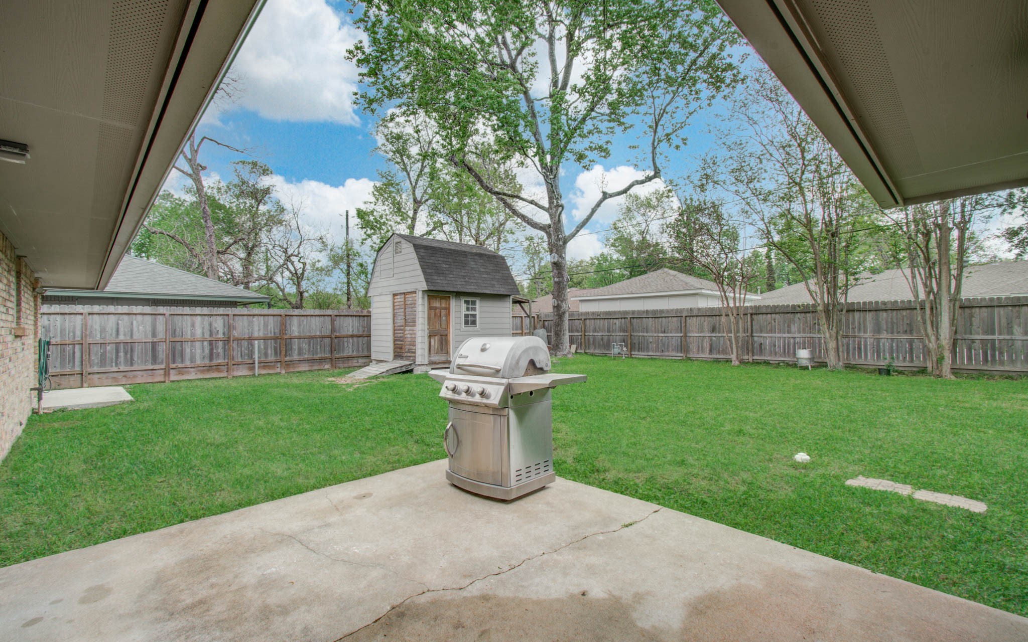 9002 Railton Street Houston, TX 77080 - Photo 28 of 32 a view of a house with a backyard