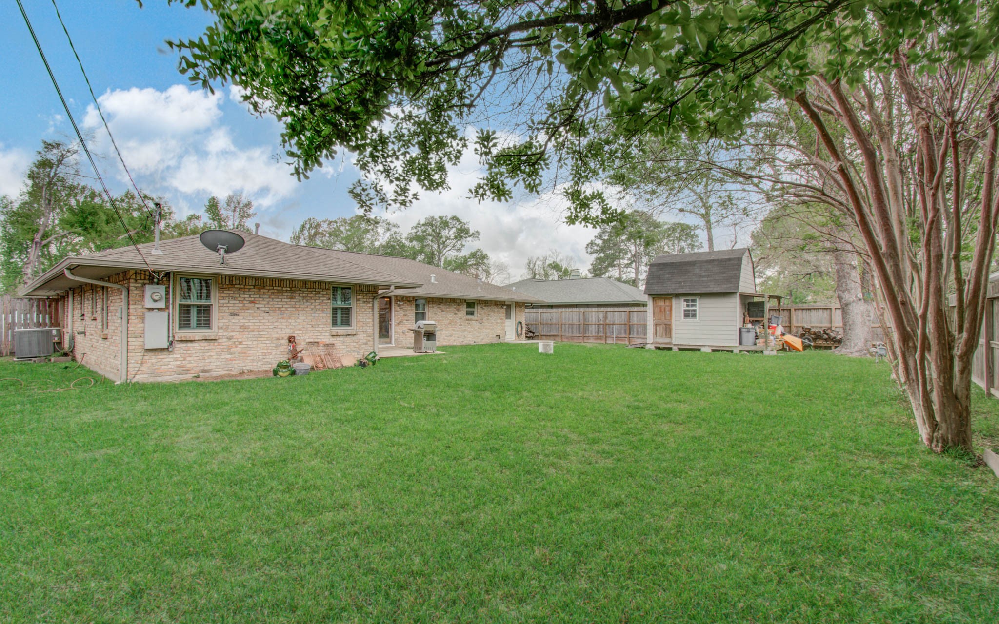 9002 Railton Street Houston, TX 77080 - Photo 31 of 32 a view of a house with a backyard