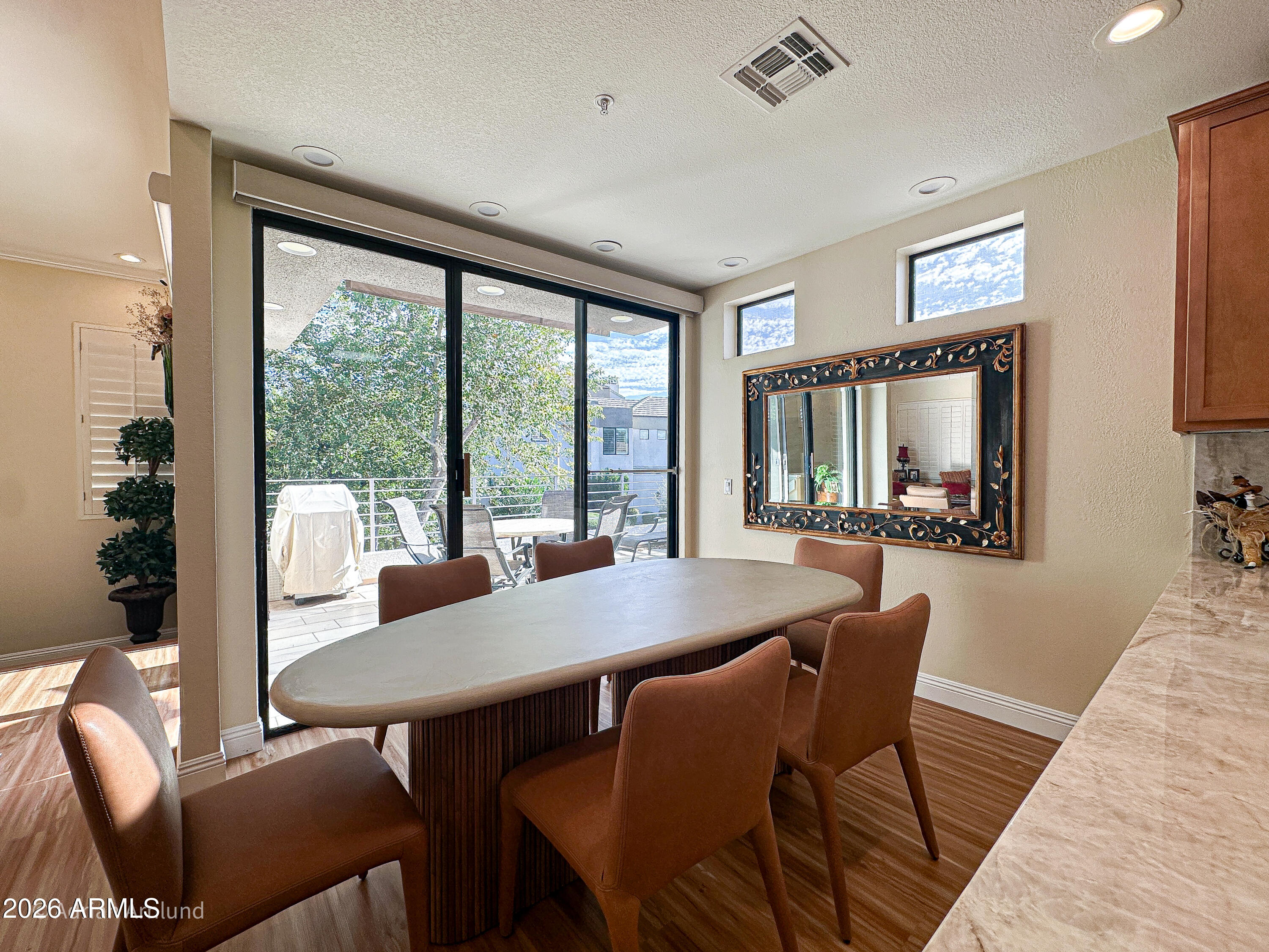 7222 East Gainey Ranch Road, Unit 224 Scottsdale, AZ 85258 - Photo 12 of 42 a view of a dining room with furniture window and outside view
