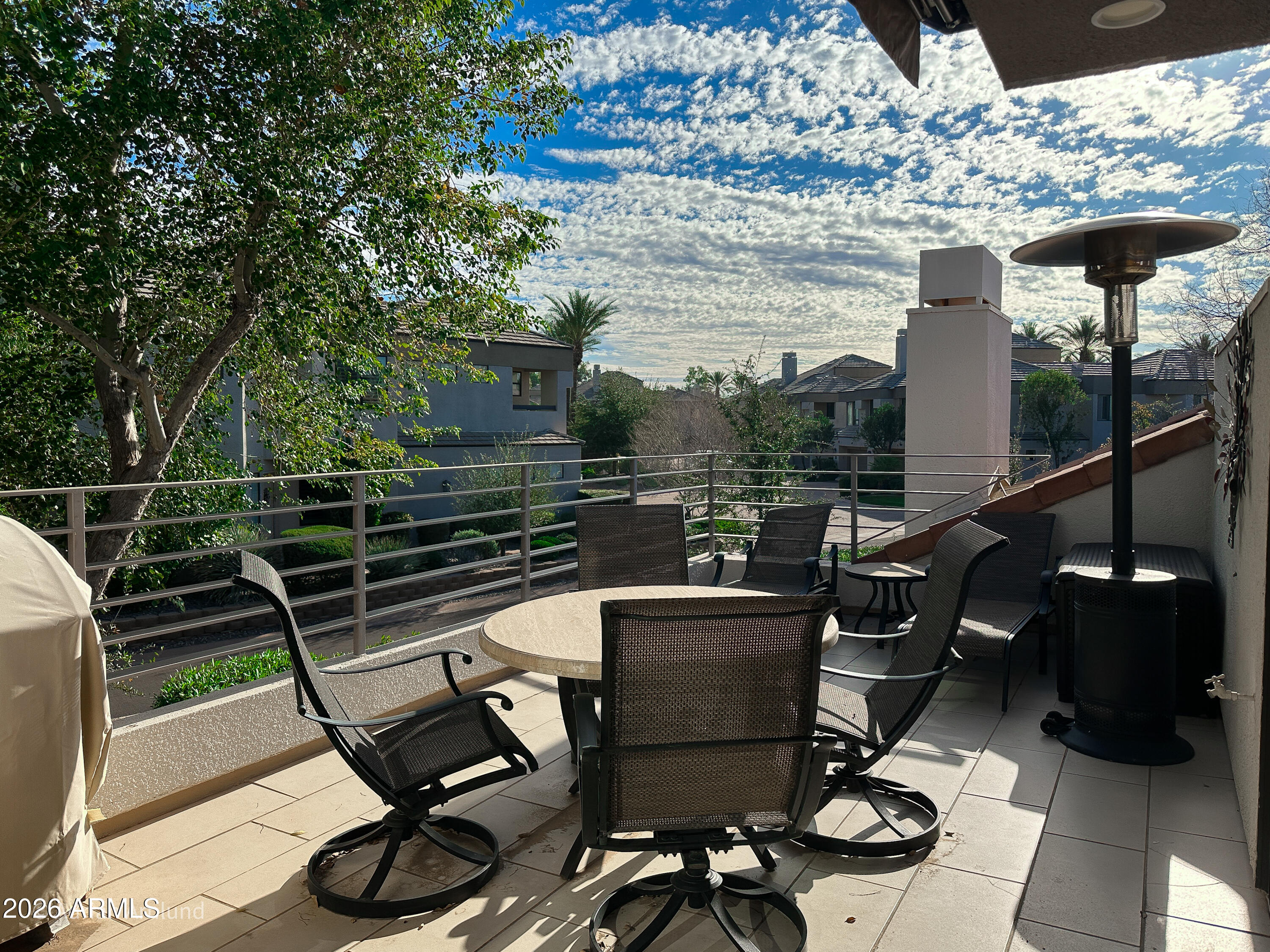 7222 East Gainey Ranch Road, Unit 224 Scottsdale, AZ 85258 - Photo 13 of 42 a view of a chairs and table in the terrace