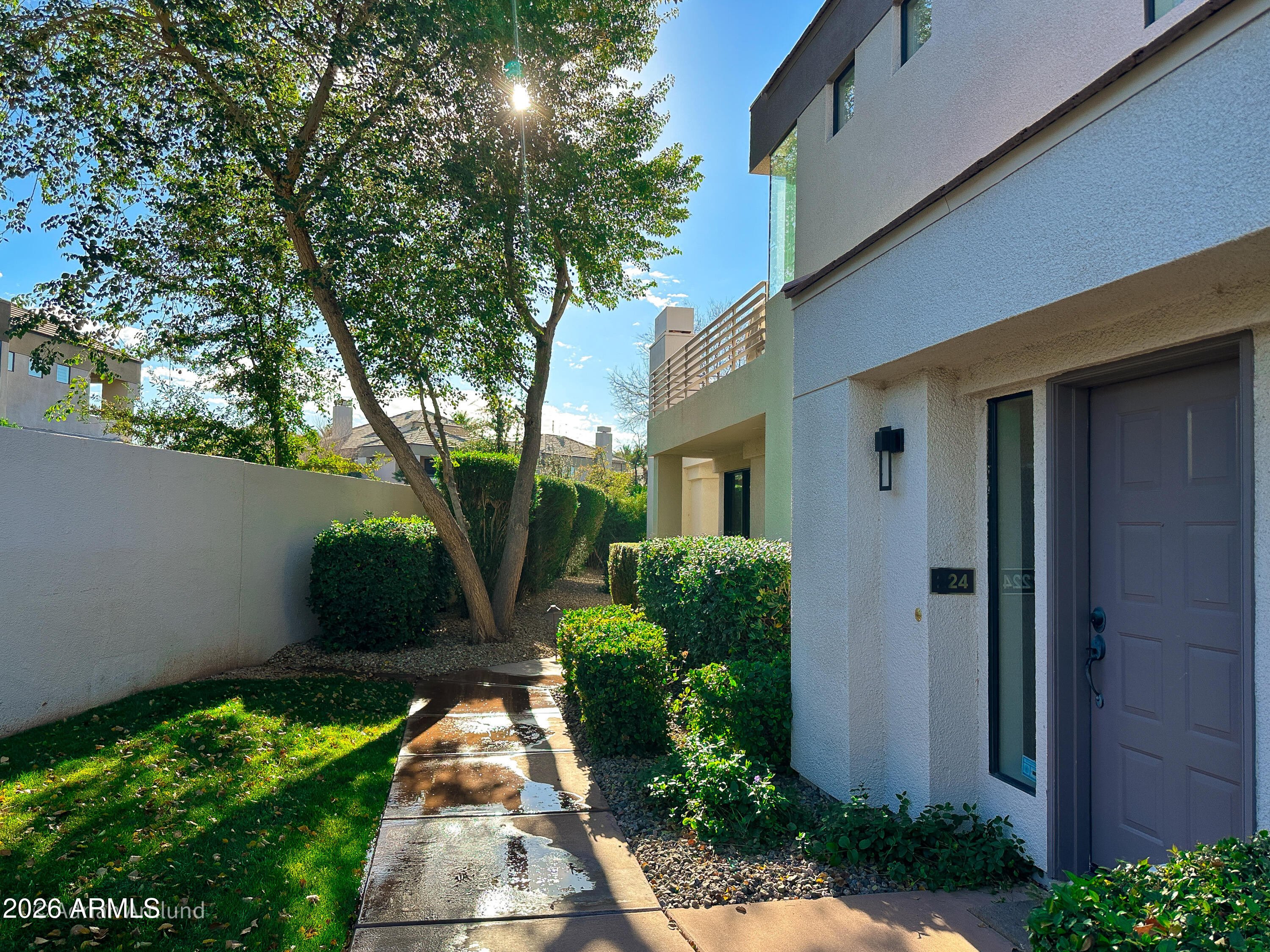 7222 East Gainey Ranch Road, Unit 224 Scottsdale, AZ 85258 - Photo 2 of 42 a view of a pathway both side of house