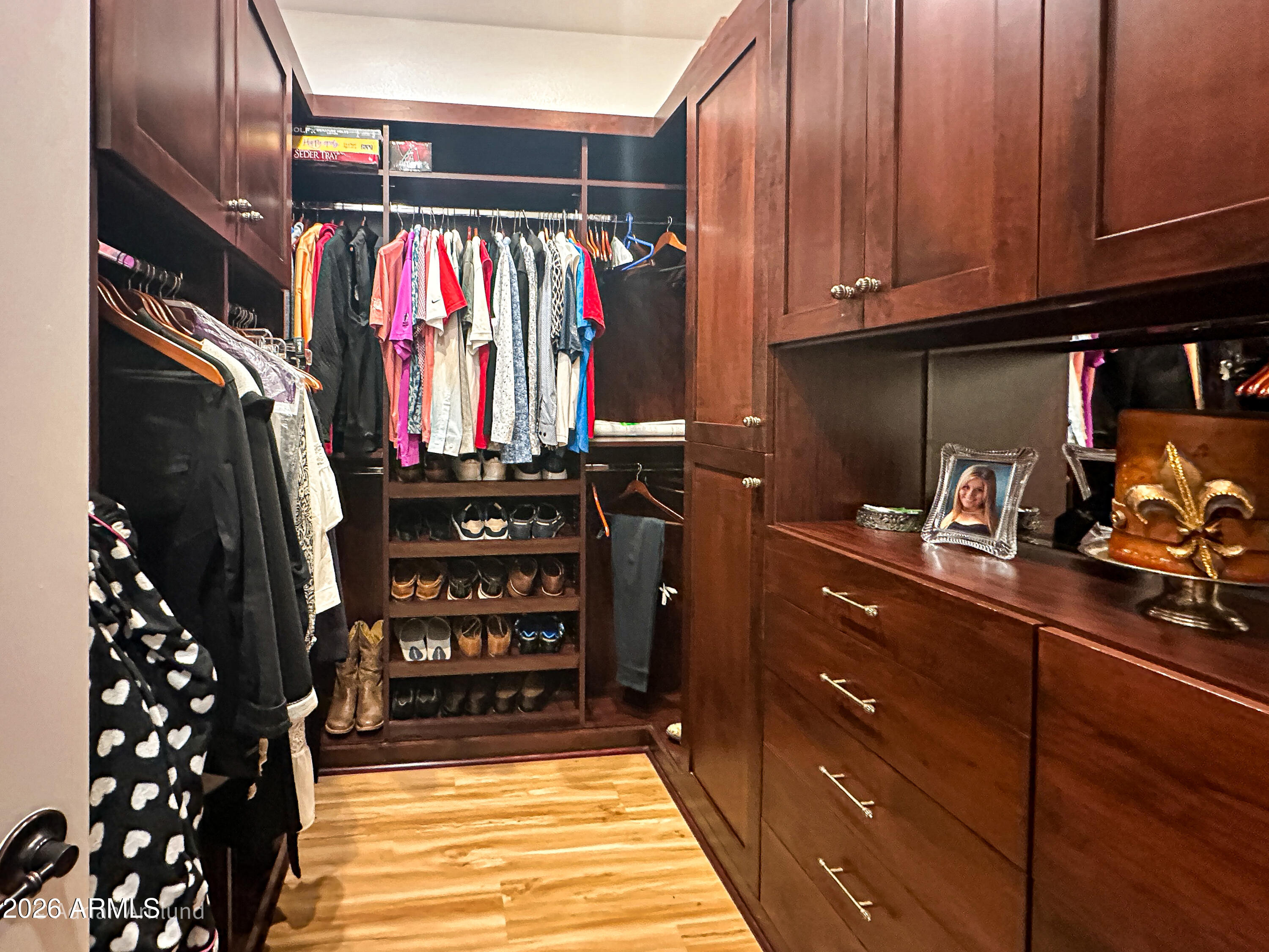 7222 East Gainey Ranch Road, Unit 224 Scottsdale, AZ 85258 - Photo 23 of 42 a view of walk in closet with clothes and shoes
