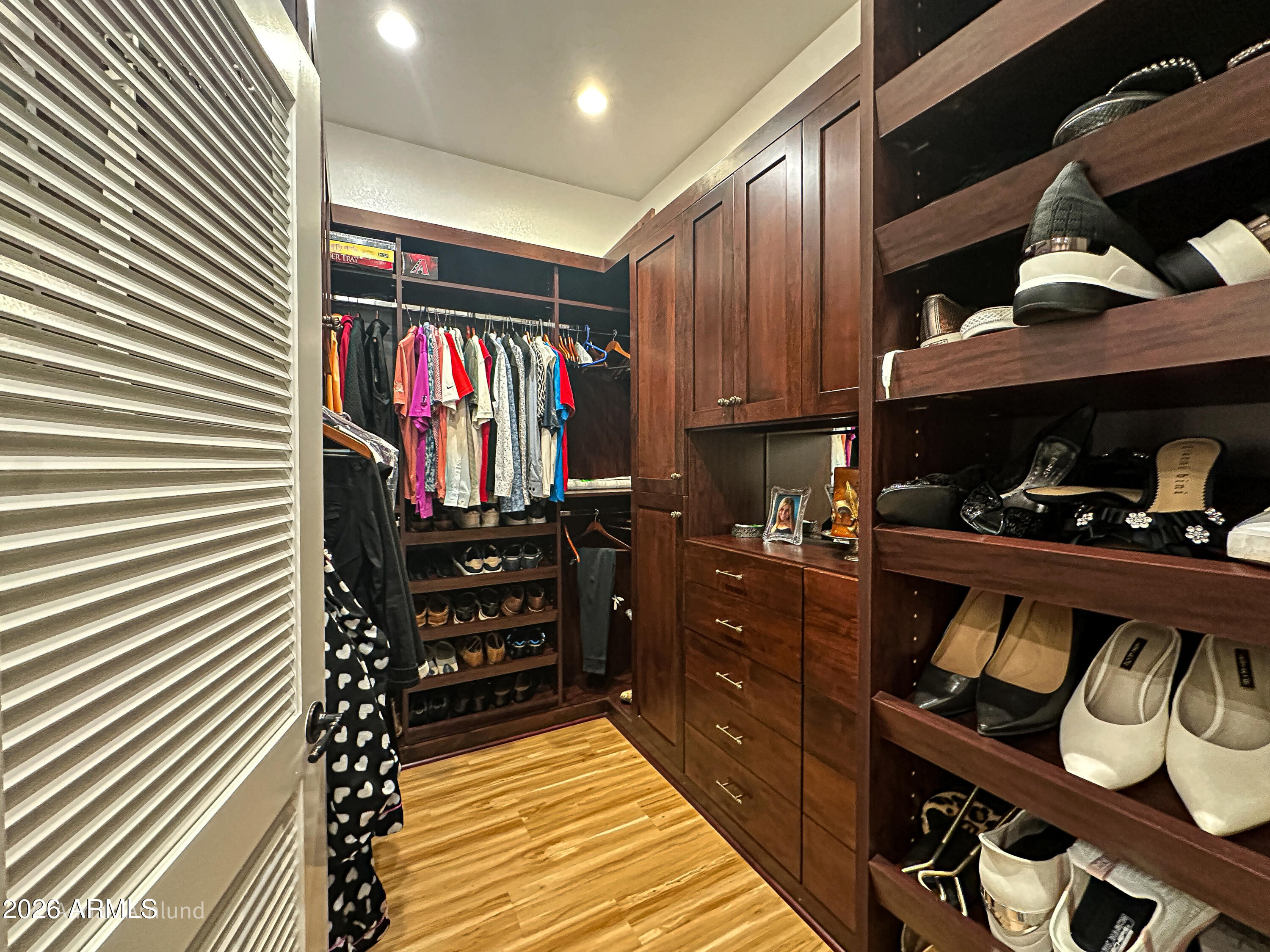7222 East Gainey Ranch Road, Unit 224 Scottsdale, AZ 85258 - Photo 25 of 42 a view of walk in closet and wooden furniture