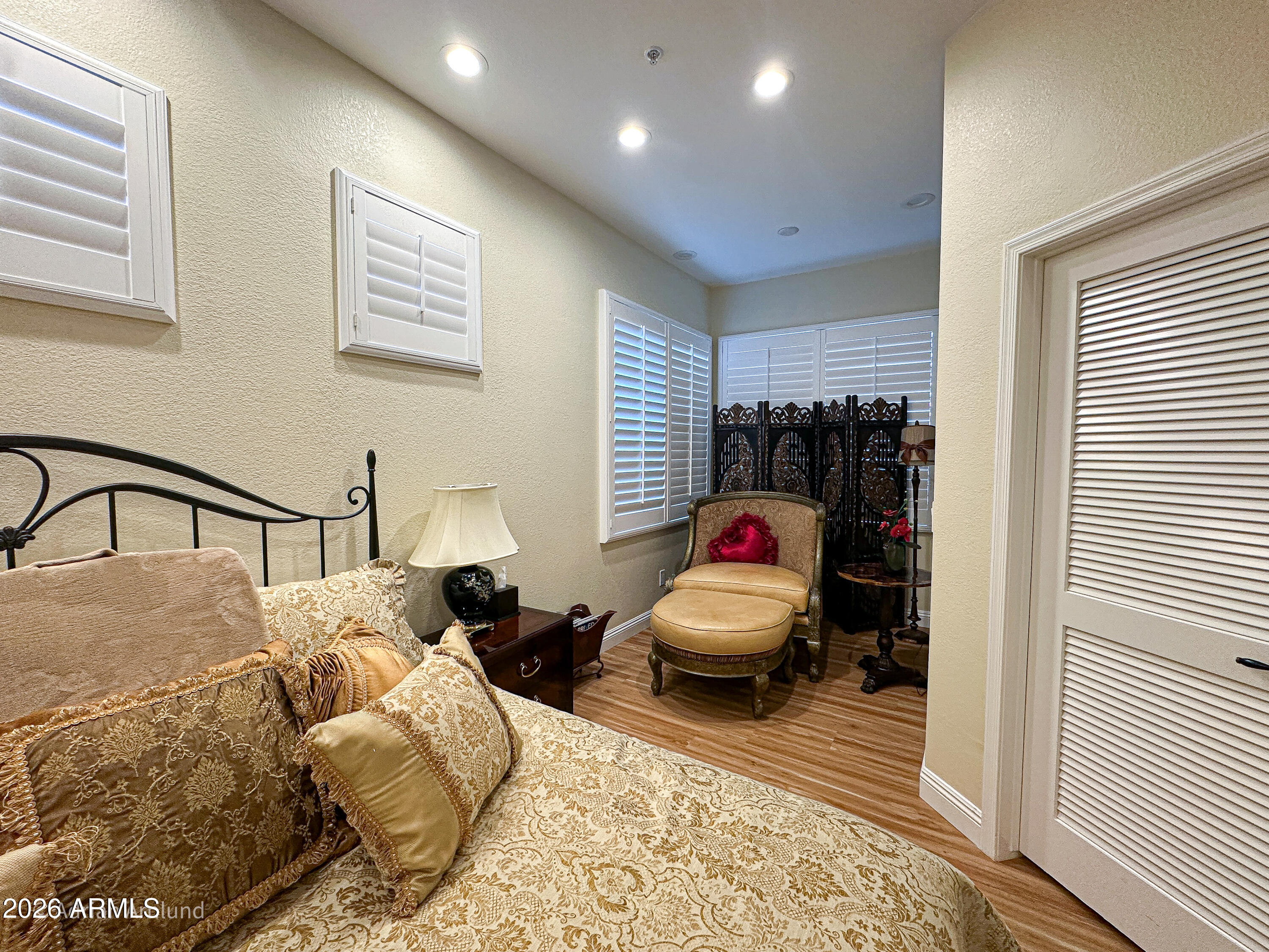7222 East Gainey Ranch Road, Unit 224 Scottsdale, AZ 85258 - Photo 27 of 42 a bedroom with bed and a window