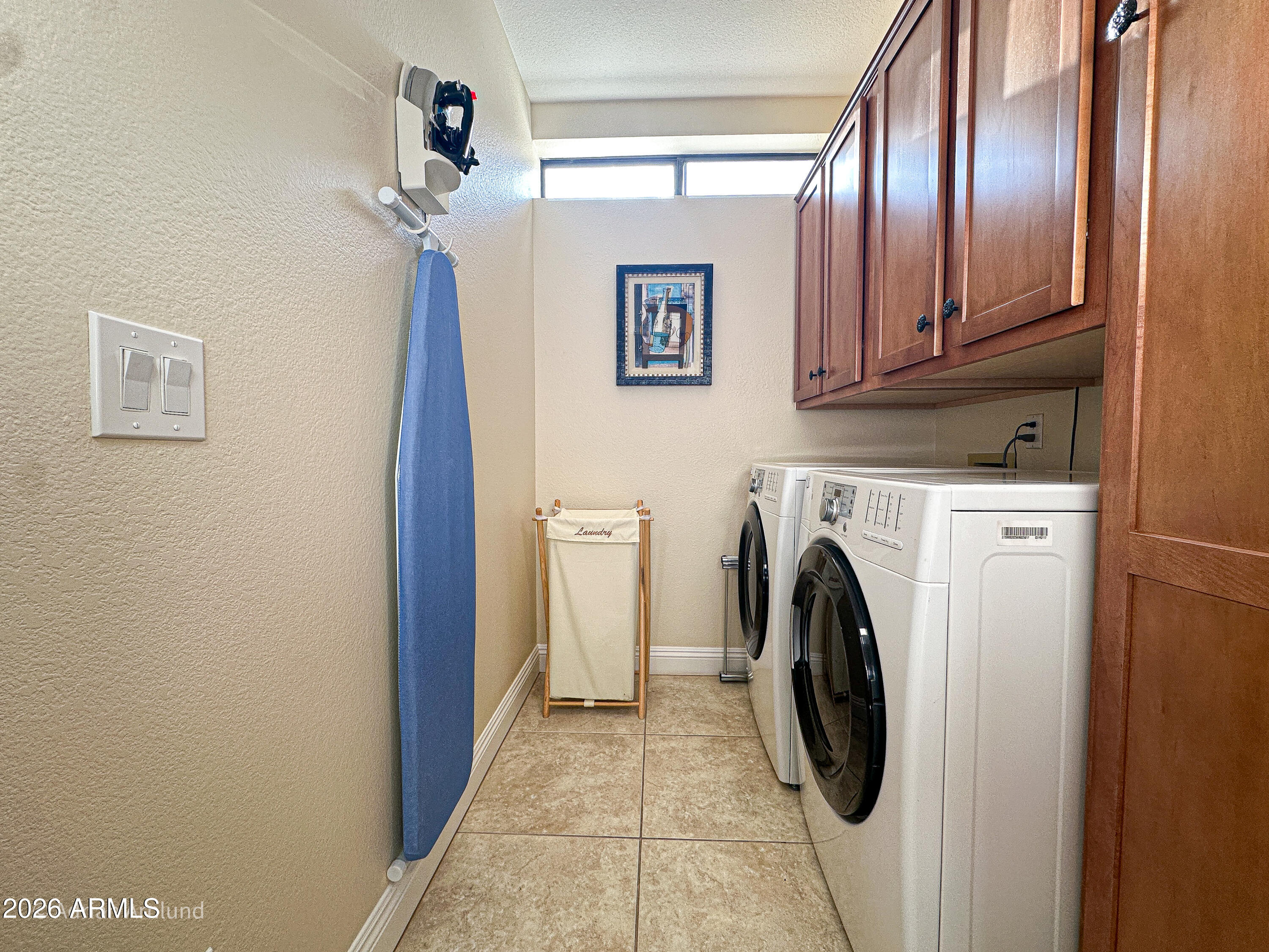7222 East Gainey Ranch Road, Unit 224 Scottsdale, AZ 85258 - Photo 31 of 42 a utility room with dryer and washer