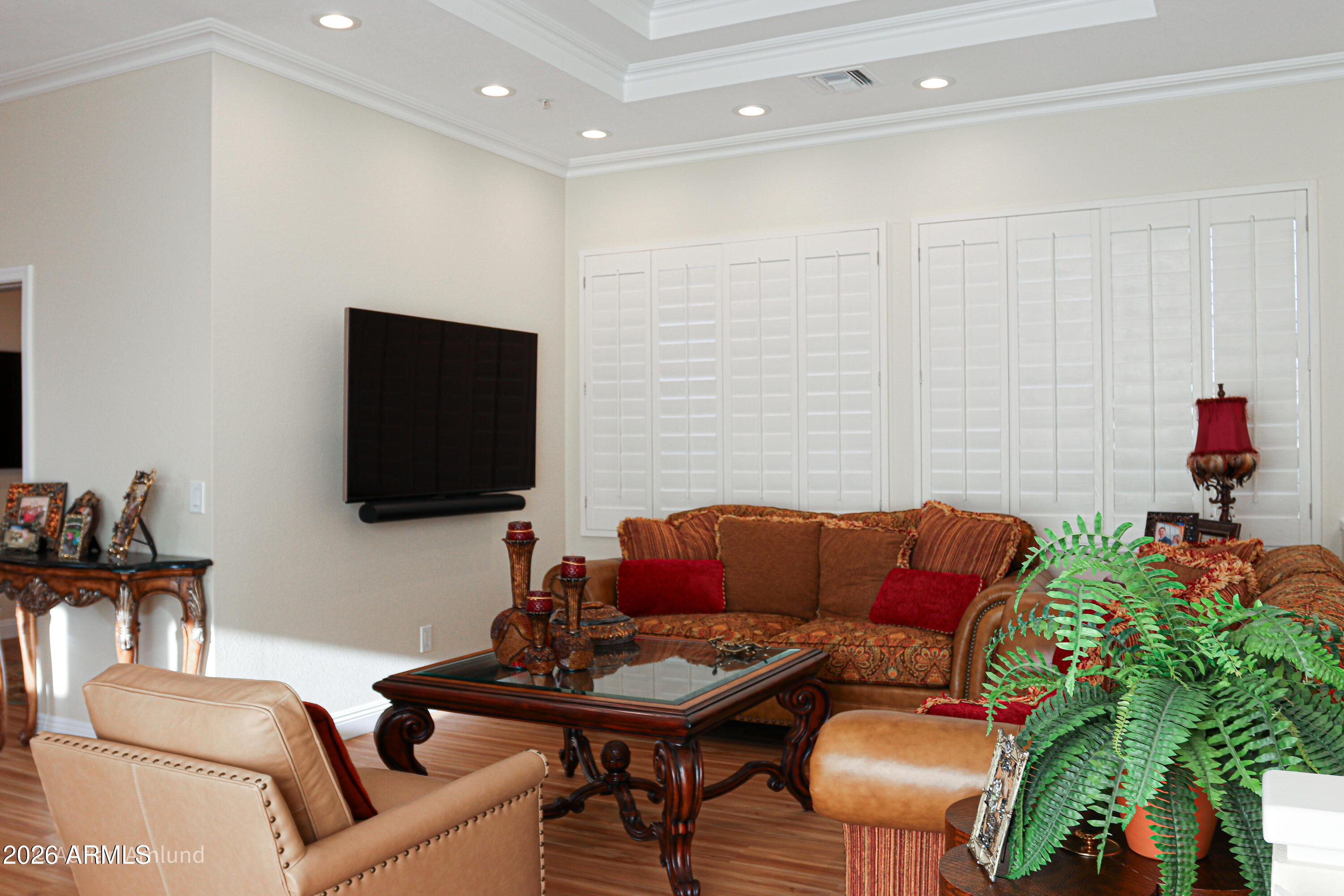 7222 East Gainey Ranch Road, Unit 224 Scottsdale, AZ 85258 - Photo 37 of 42 a living room with furniture and a flat screen tv