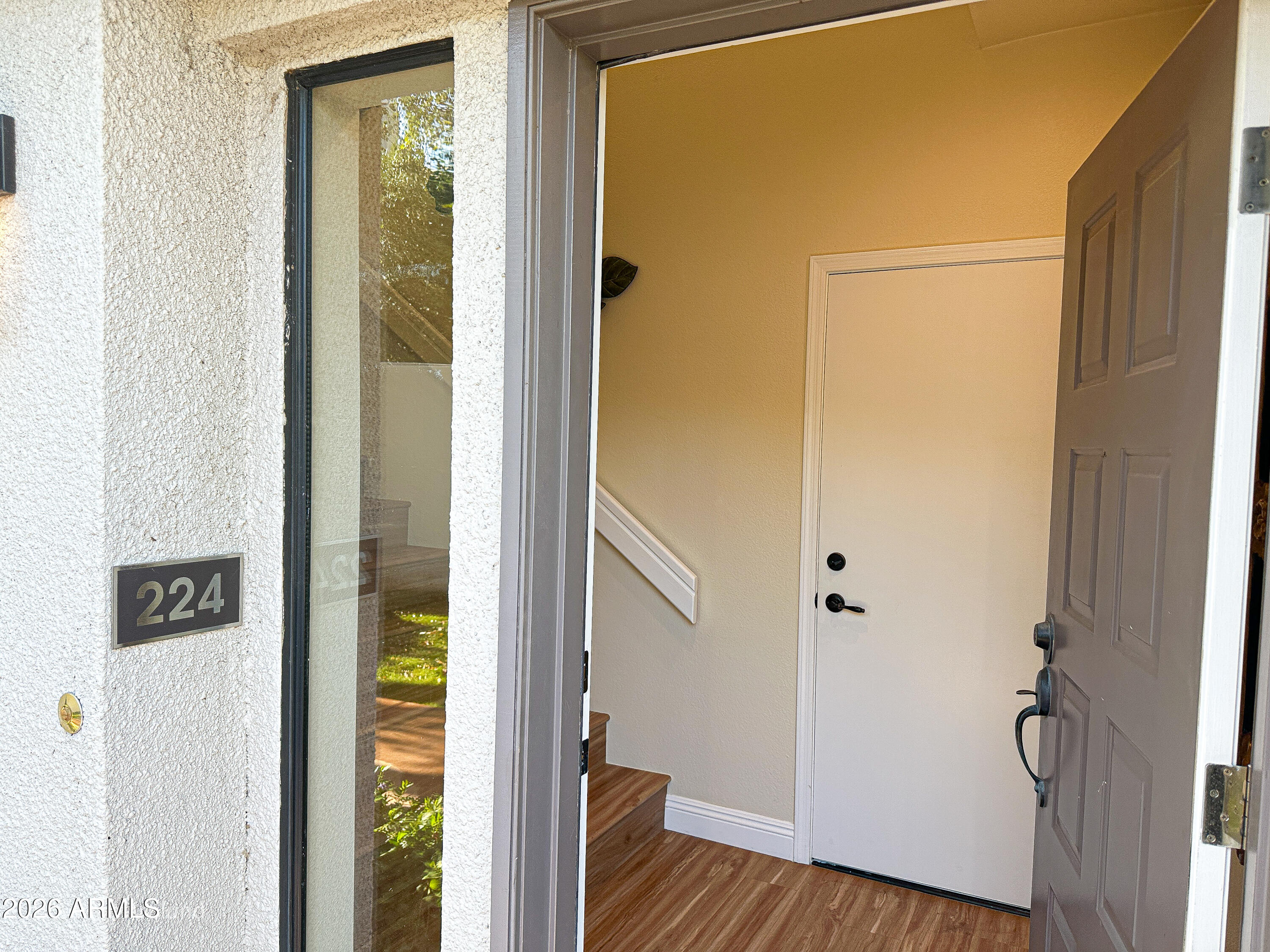 7222 East Gainey Ranch Road, Unit 224 Scottsdale, AZ 85258 - Photo 5 of 42 a view of a bedroom from a hallway