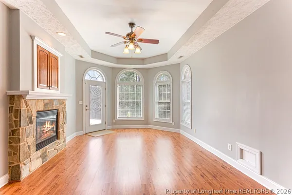 a bathroom with a tub a sink and a window