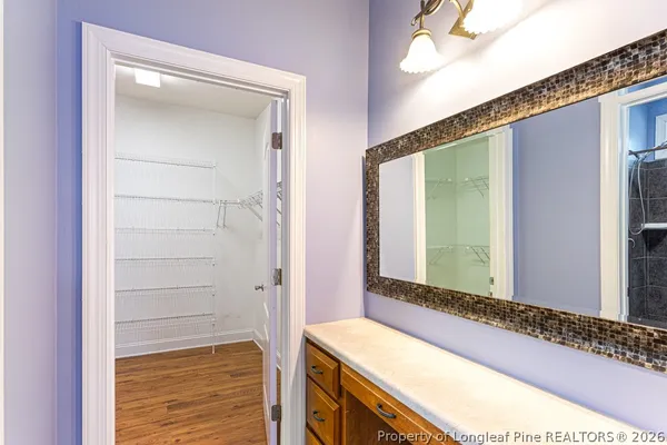 a bathroom with a double vanity sink mirror and