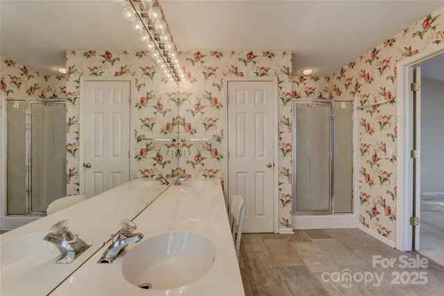 a bathroom with a sink and a shower curtain
