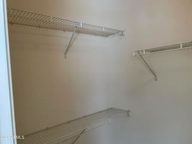 a view of a room with racks on the wall