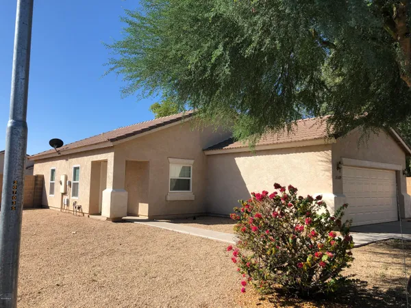 front view of a house with a yard