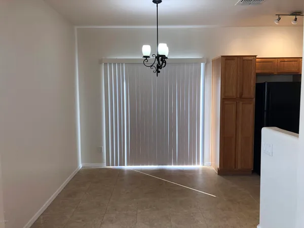 a view of a livingroom with a chandelier fan