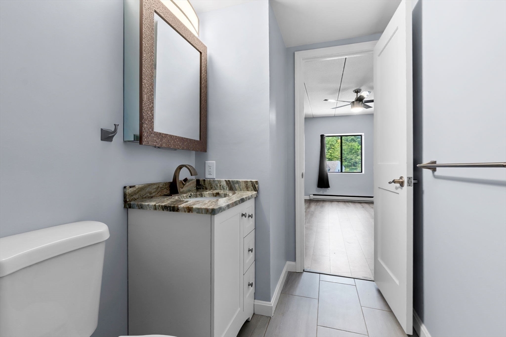 133 Franklin Street, Unit 503 Stoneham, MA 02180 - Photo 13 of 23 a bathroom with a sink and a toilet