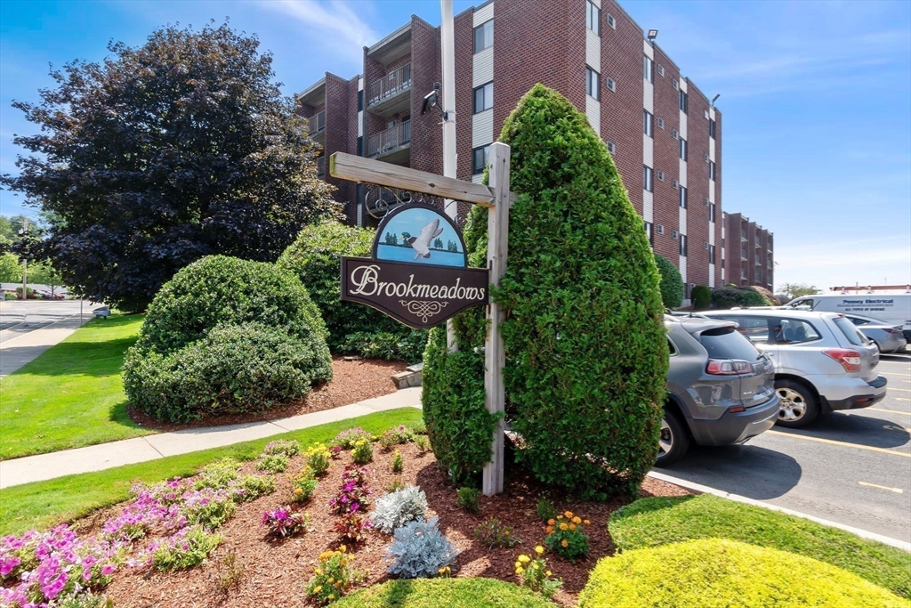 133 Franklin Street, Unit 503 Stoneham, MA 02180 - Photo 23 of 23 a view of sign board with buildings in the background