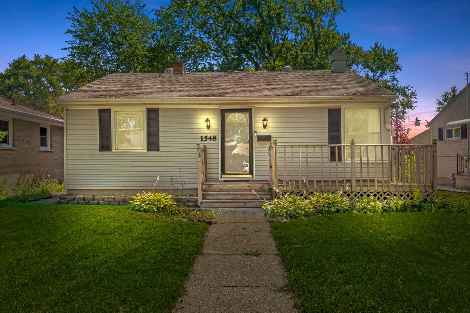 1548 South 5th Avenue Kankakee, IL 60901 - Photo 1 of 18 a front view of a house with garden