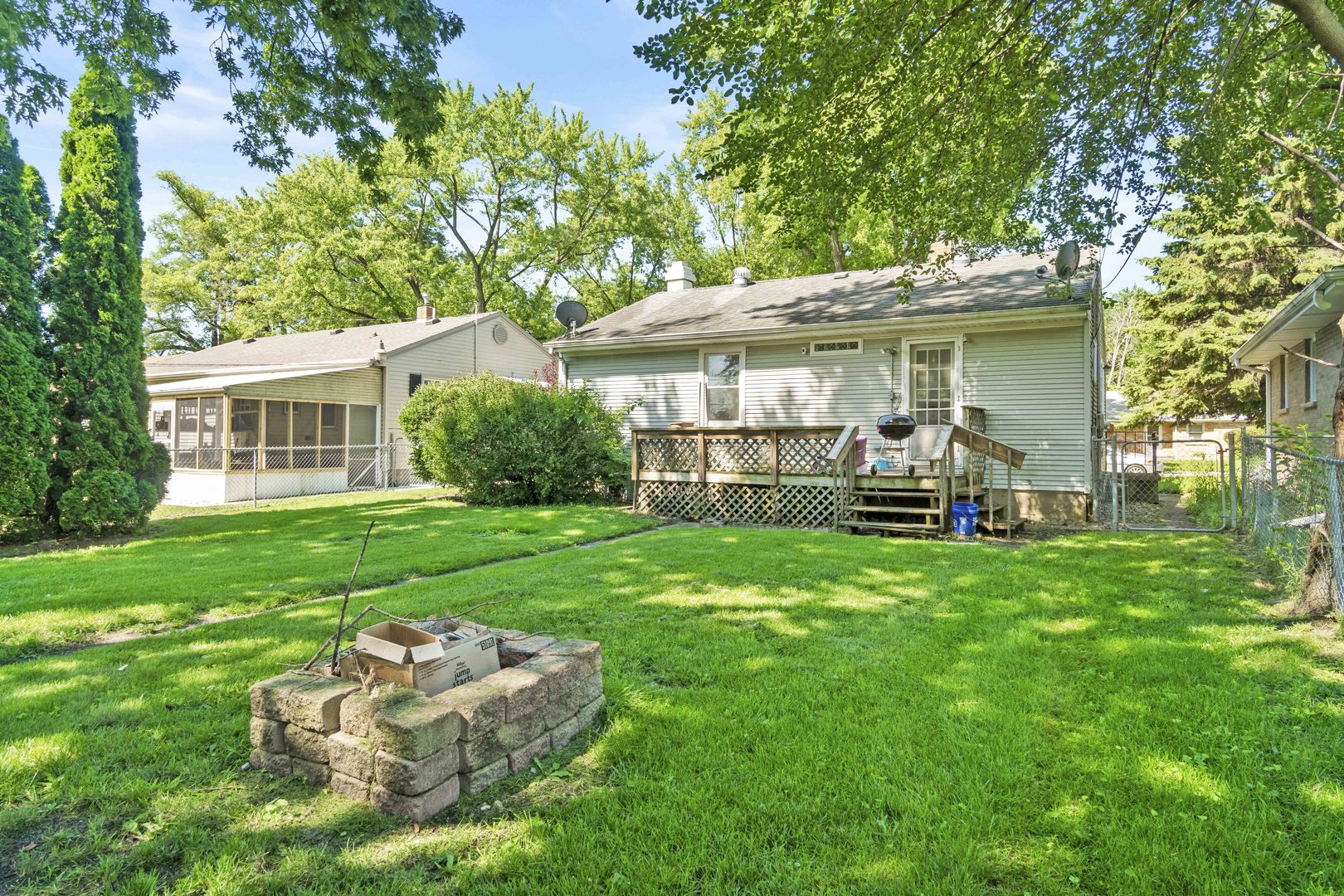 1548 South 5th Avenue Kankakee, IL 60901 - Photo 13 of 18 a front view of a house with a yard porch and outdoor seating