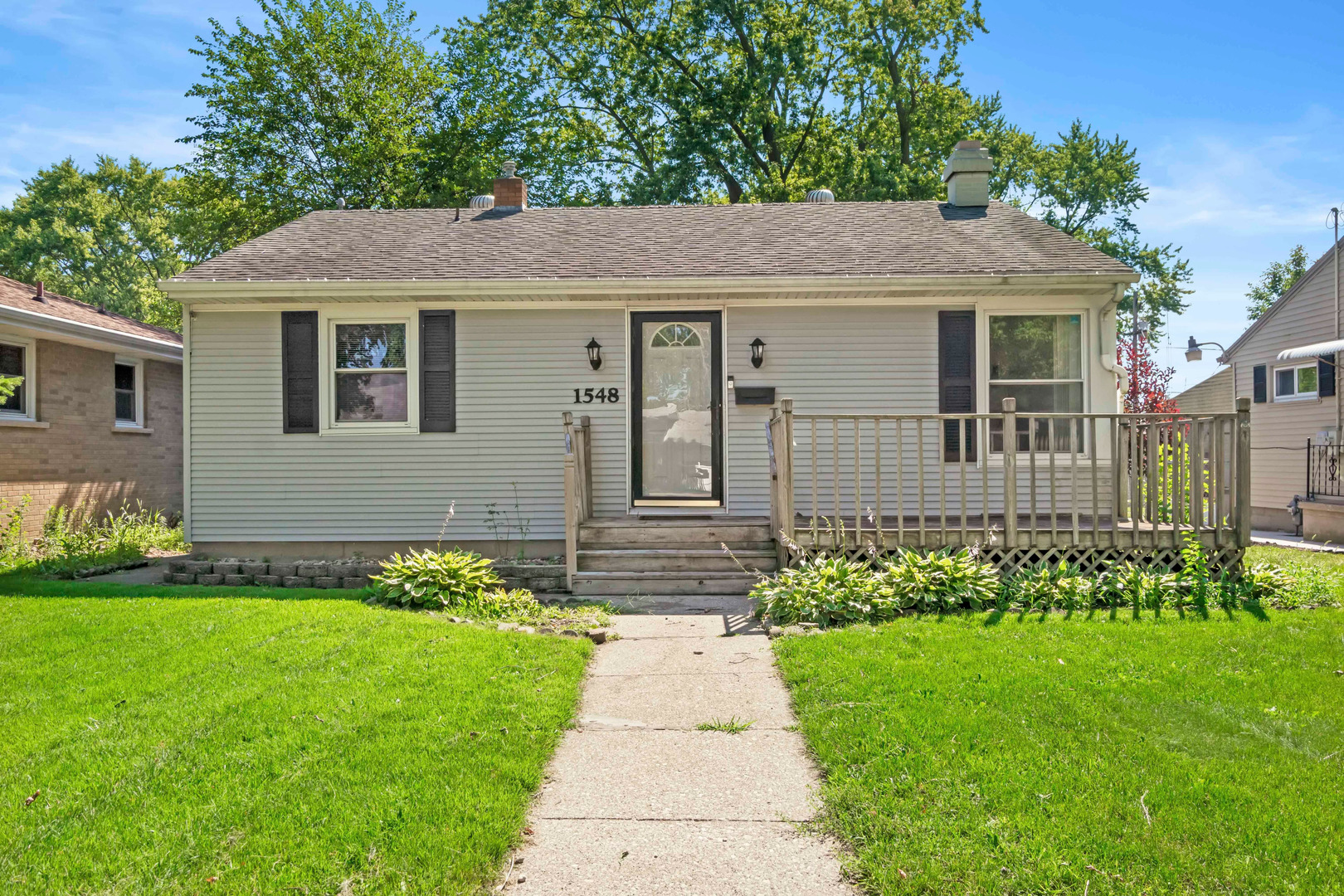 1548 South 5th Avenue Kankakee, IL 60901 - Photo 2 of 18 a front view of a house with garden