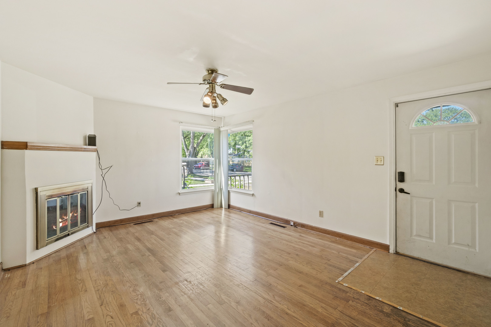 1548 South 5th Avenue Kankakee, IL 60901 - Photo 4 of 18 wooden floor in an empty room with a window