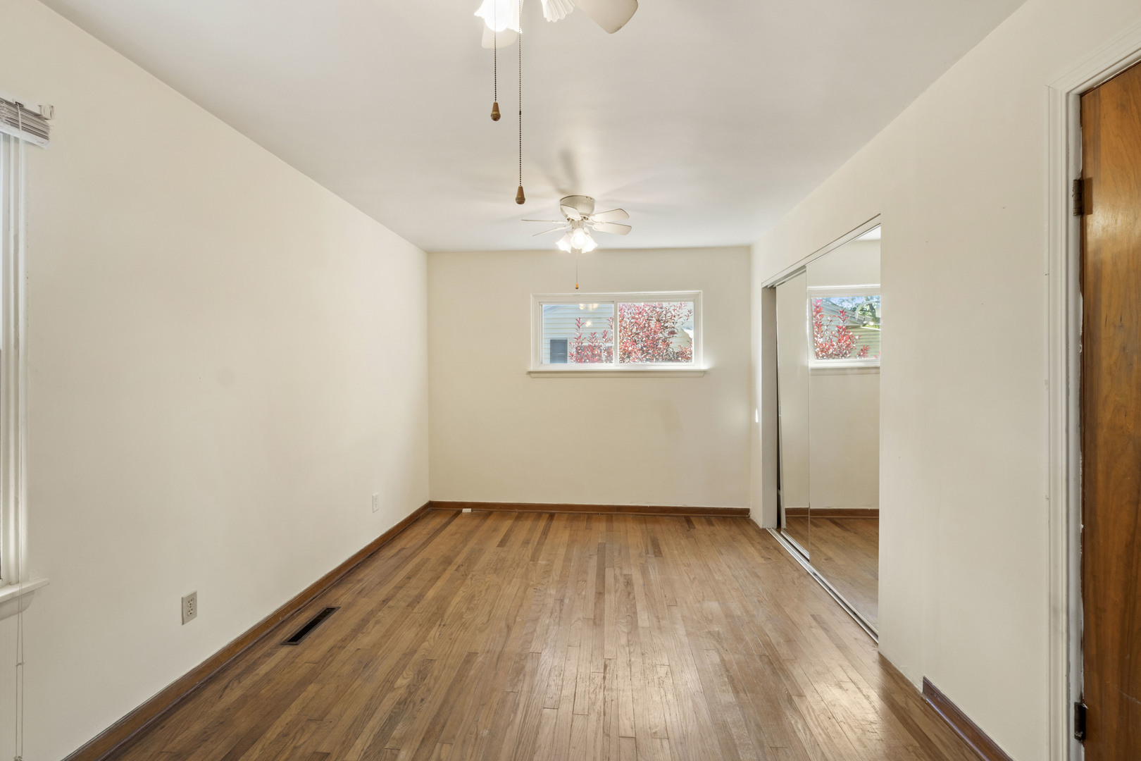 1548 South 5th Avenue Kankakee, IL 60901 - Photo 10 of 18 a view of an empty room with wooden floor