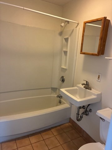 59 South Huntington Avenue, Unit 8 Boston, MA 02130 - Photo 4 of 5 a bathroom with a sink and a mirror