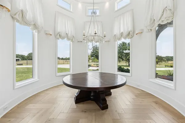 a dining room with table and chairs