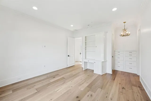 an empty room with wooden floor