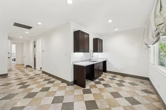 a bathroom with a sink mirror and shower