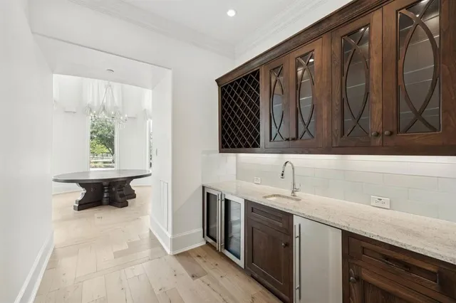 a kitchen with a sink and a refrigerator