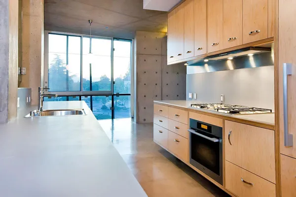 a kitchen with granite countertop a stove and a sink