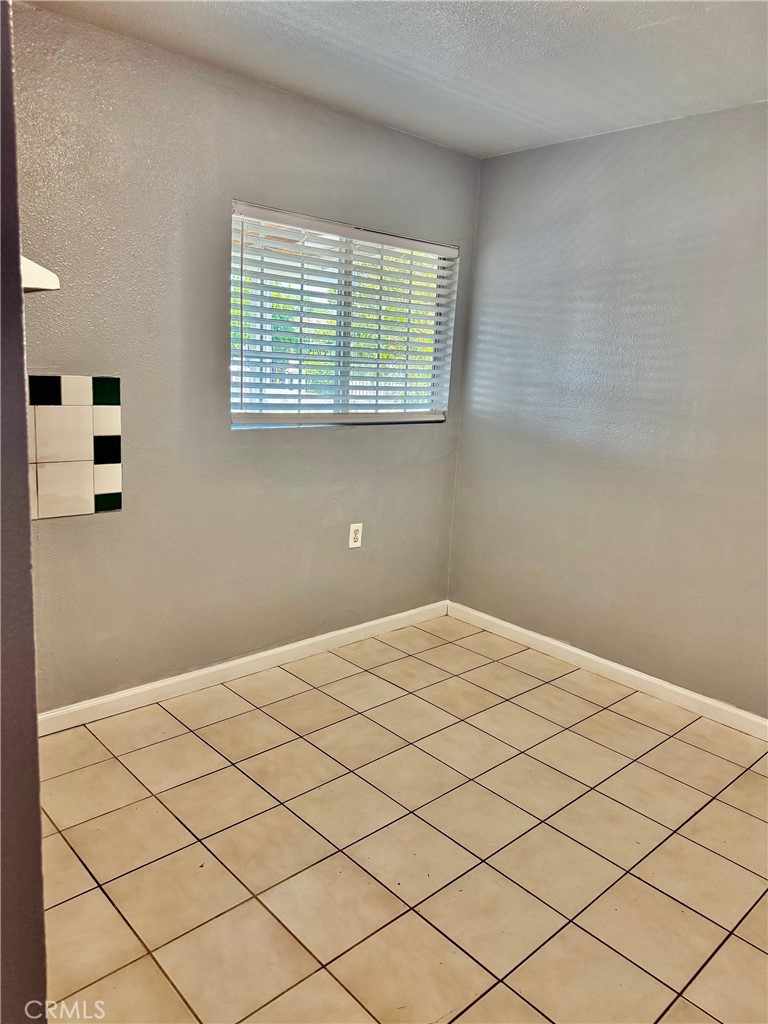 12931 Fourth Street Chino, CA 91710 - Photo 11 of 34 a bedroom with a bed and a window