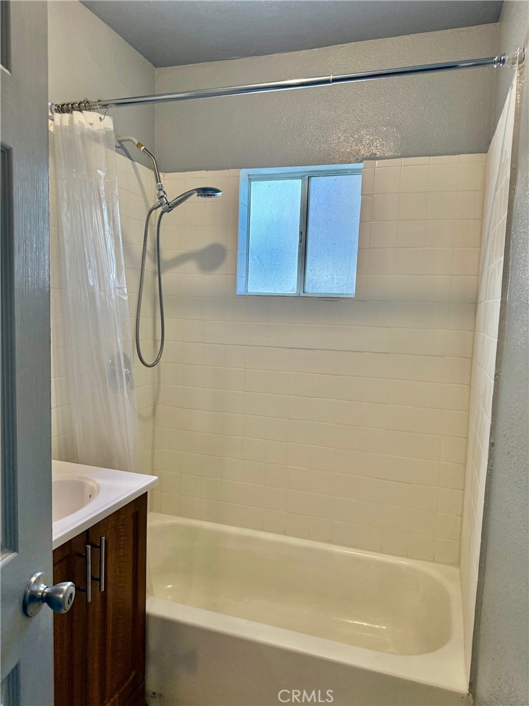12931 Fourth Street Chino, CA 91710 - Photo 17 of 34 a bathroom with a shower and a shower