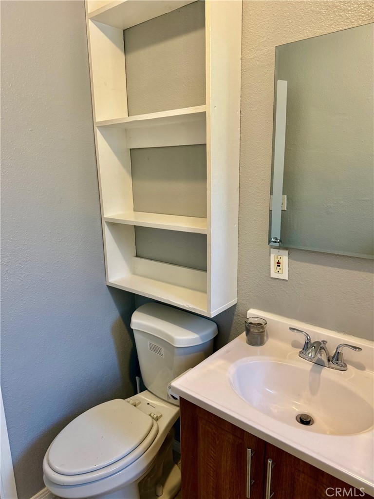 12931 Fourth Street Chino, CA 91710 - Photo 18 of 34 a bathroom with a sink and a toilet