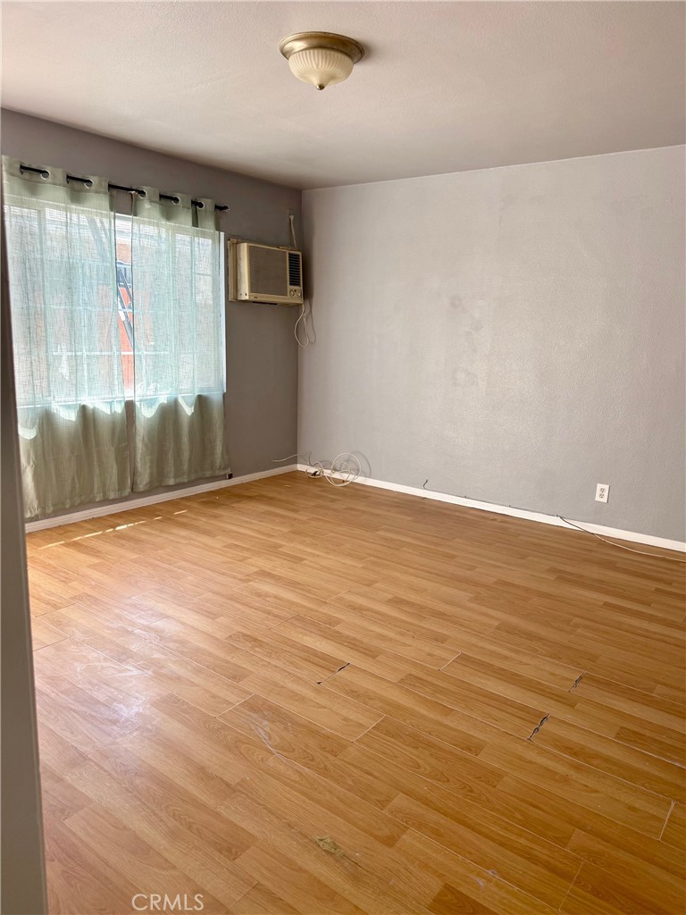 12931 Fourth Street Chino, CA 91710 - Photo 19 of 34 wooden floor in an empty room with a window