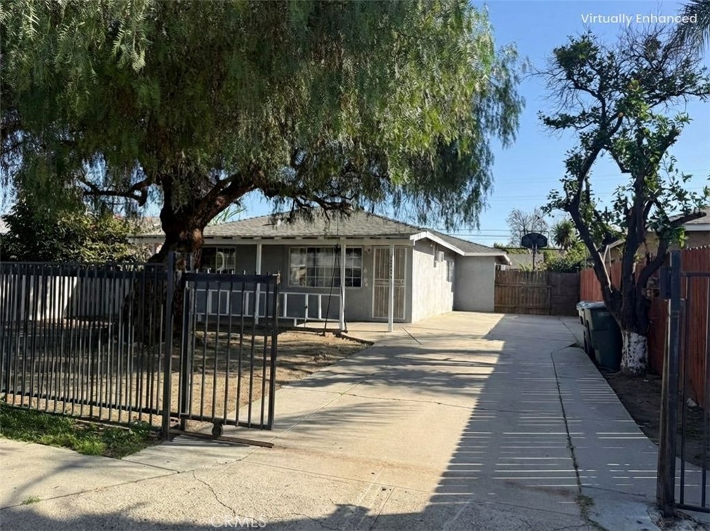 12931 Fourth Street Chino, CA 91710 - Photo 2 of 34 a front view of a house with a garden