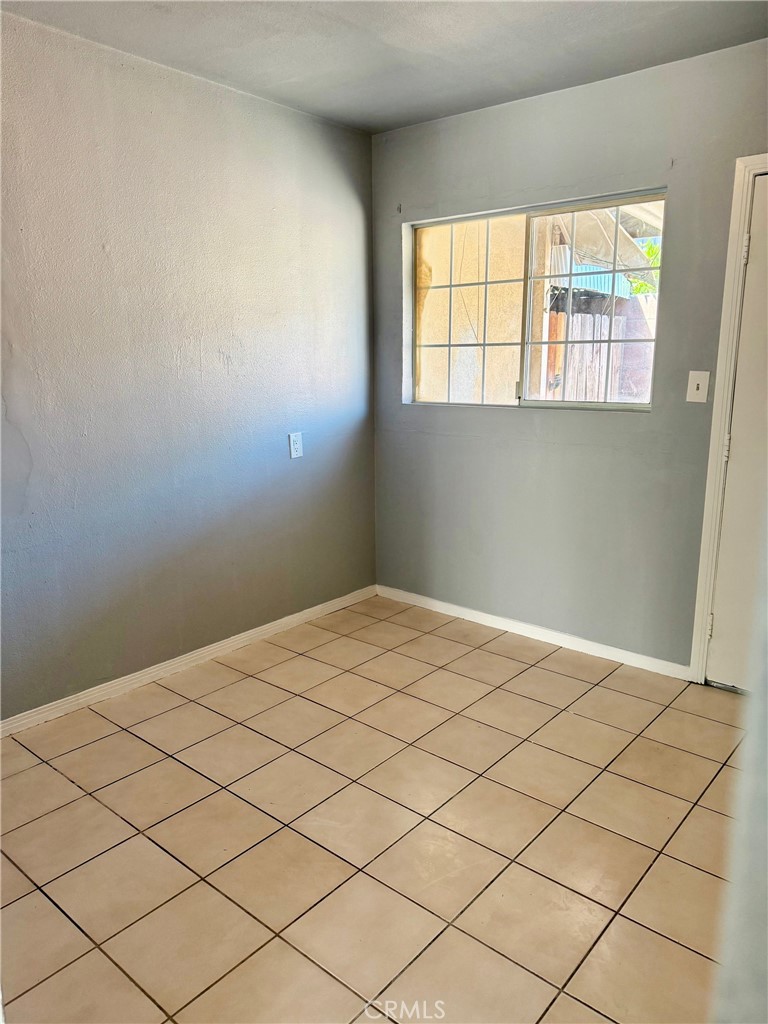 12931 Fourth Street Chino, CA 91710 - Photo 24 of 34 a bedroom with a bed and a window