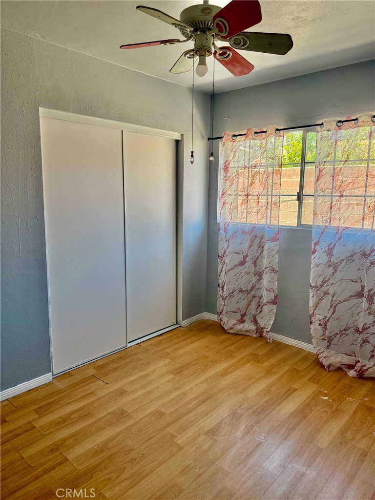 12931 Fourth Street Chino, CA 91710 - Photo 29 of 34 a bedroom with a large bed and a chandelier