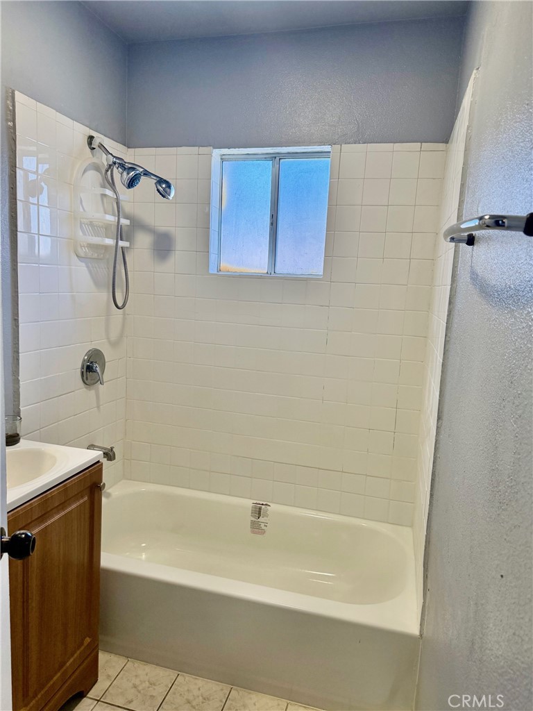12931 Fourth Street Chino, CA 91710 - Photo 30 of 34 a bathroom with a shower and a bathtub