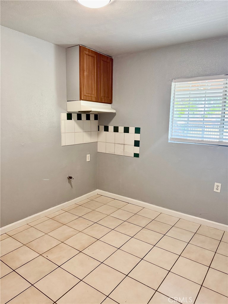 12931 Fourth Street Chino, CA 91710 - Photo 10 of 34 a bedroom with a bed and a window