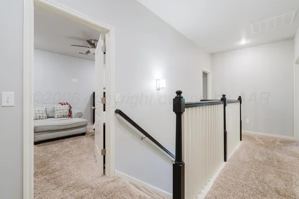 a view of staircase with rug